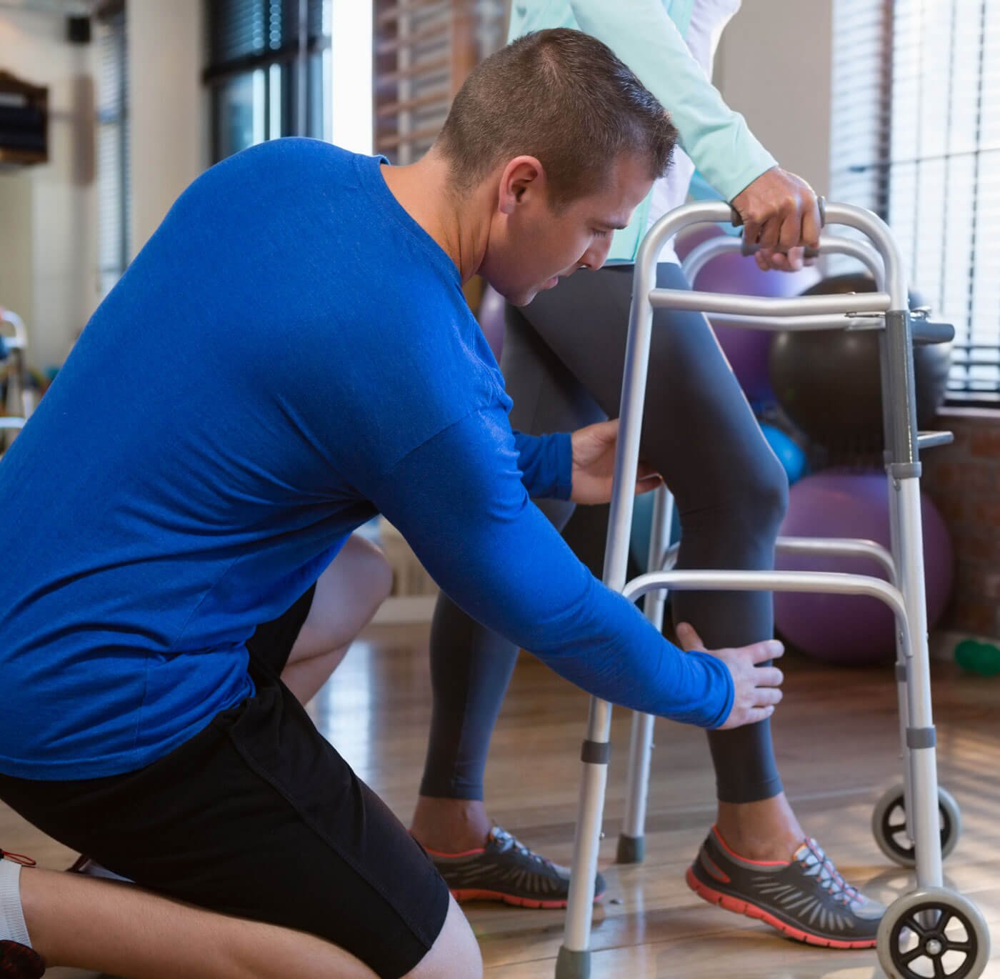 Falls Prevention Physiotherapist With Elder Person